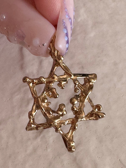 Estate 14K gold brutalist Star of David pendant with textured organic surface treatment showing dimensional sculptural design