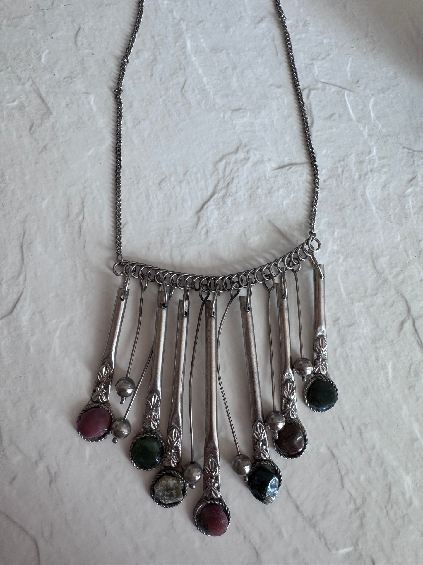 Estate vintage silver fringe necklace with multiple natural stones in purple green and brown tones showing bohemian statement jewelry design