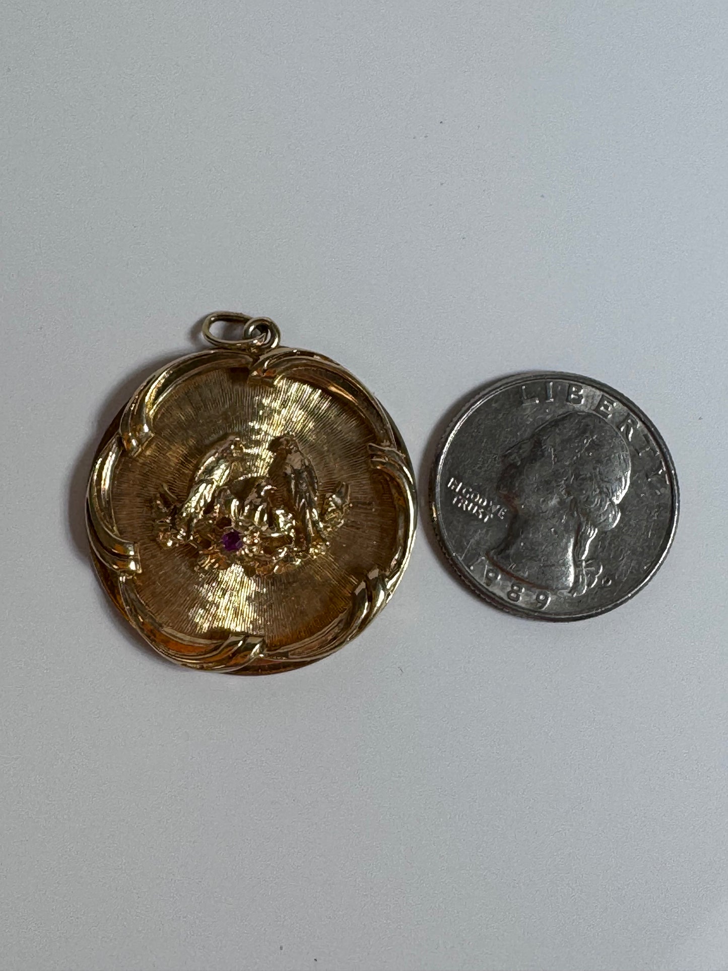 1950s 14K gold love birds medallion pendant with engine turned background and ruby accent, vintage romantic jewelry