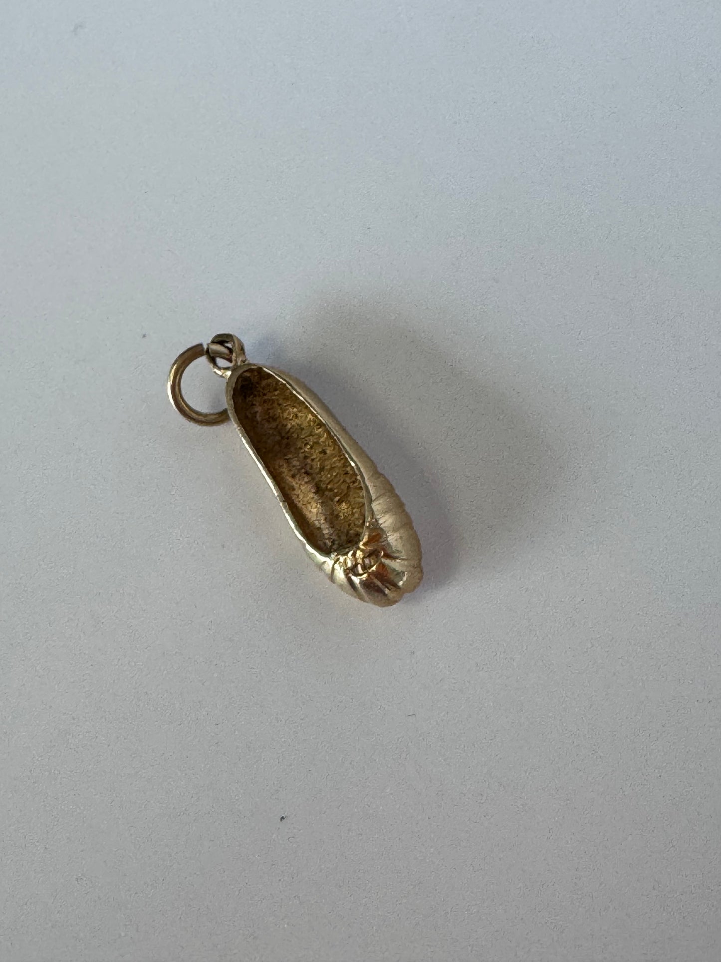1950s vintage 14K gold ballet slipper charm with textured details, dimensional dance shoe design