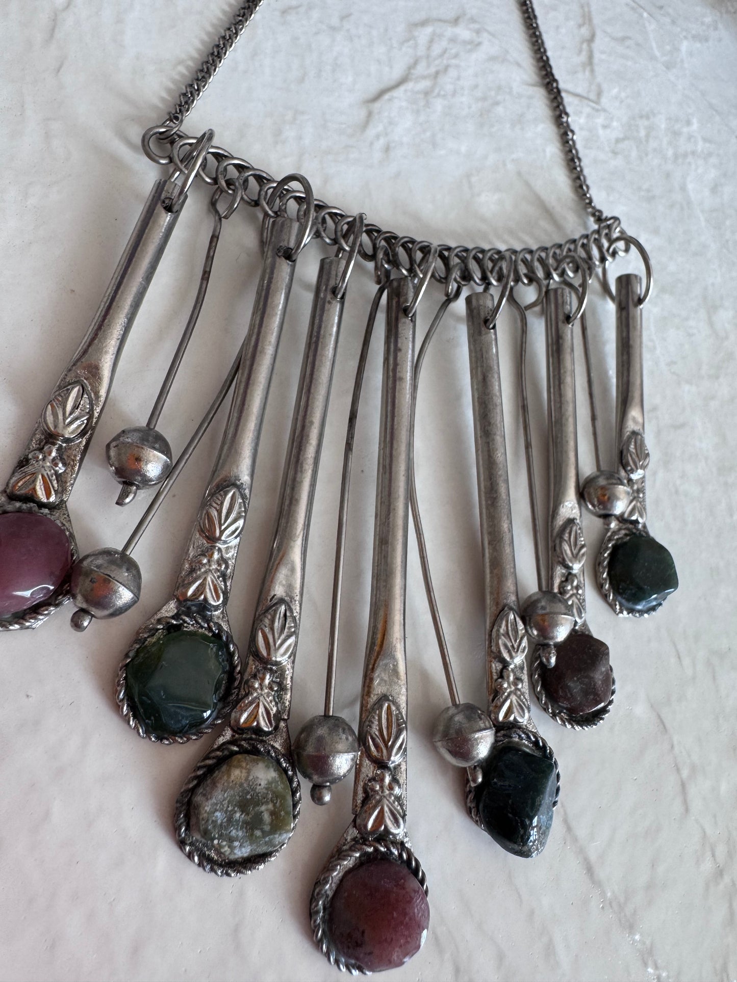 Estate vintage silver fringe necklace with multiple natural stones in purple green and brown tones showing bohemian statement jewelry design