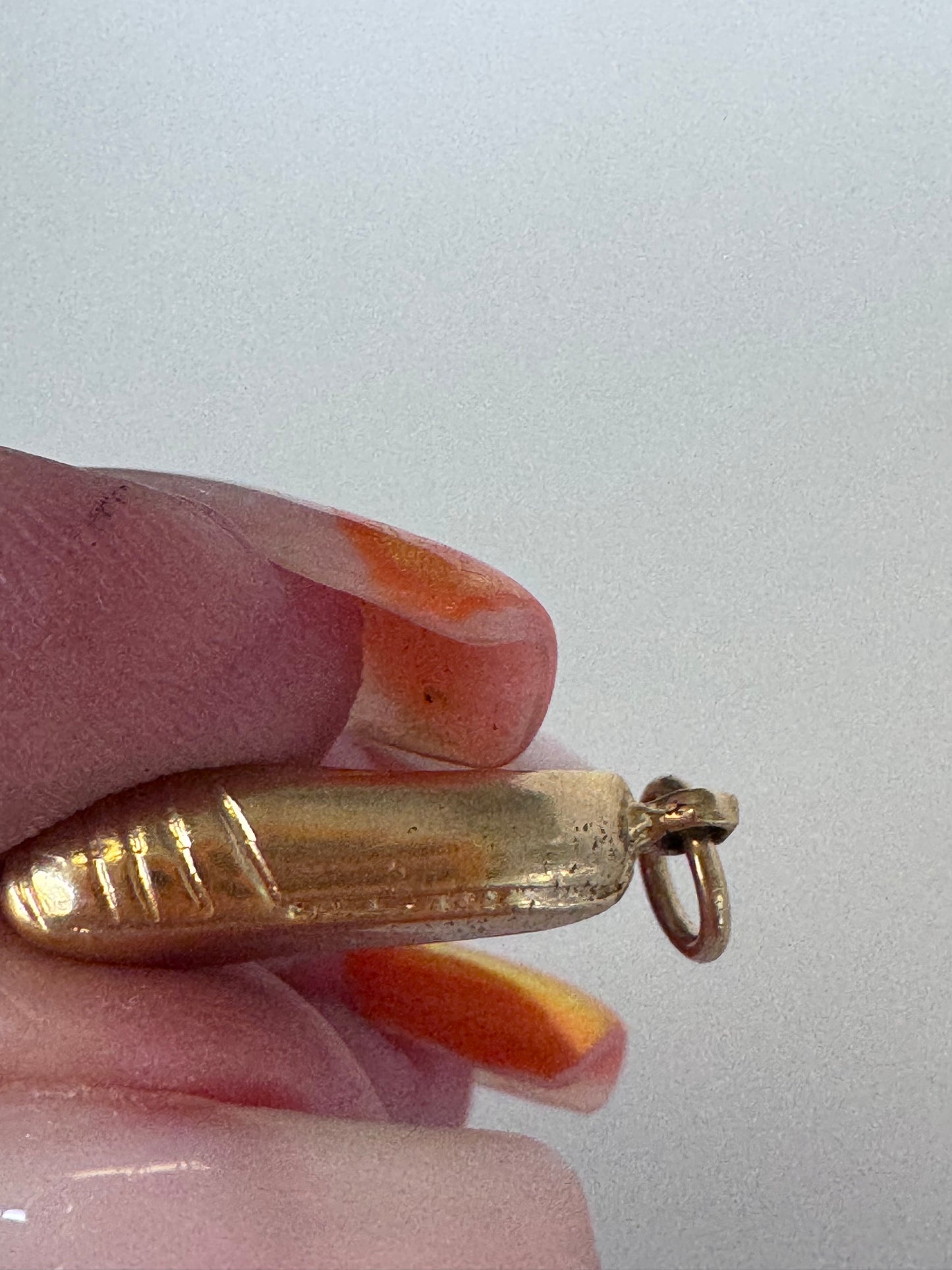 1950s vintage 14K gold ballet slipper charm with textured details, dimensional dance shoe design