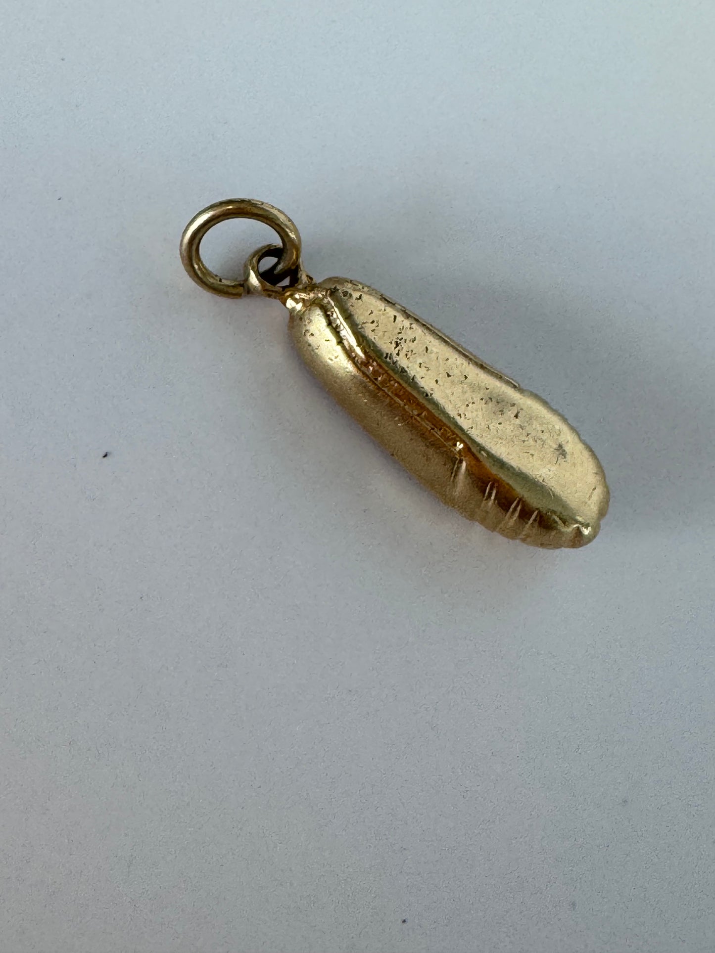 1950s vintage 14K gold ballet slipper charm with textured details, dimensional dance shoe design