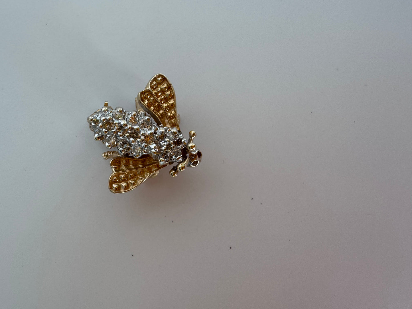 Estate 14K gold bee brooch with diamond-encrusted body and textured wings, vintage insect pin jewelry