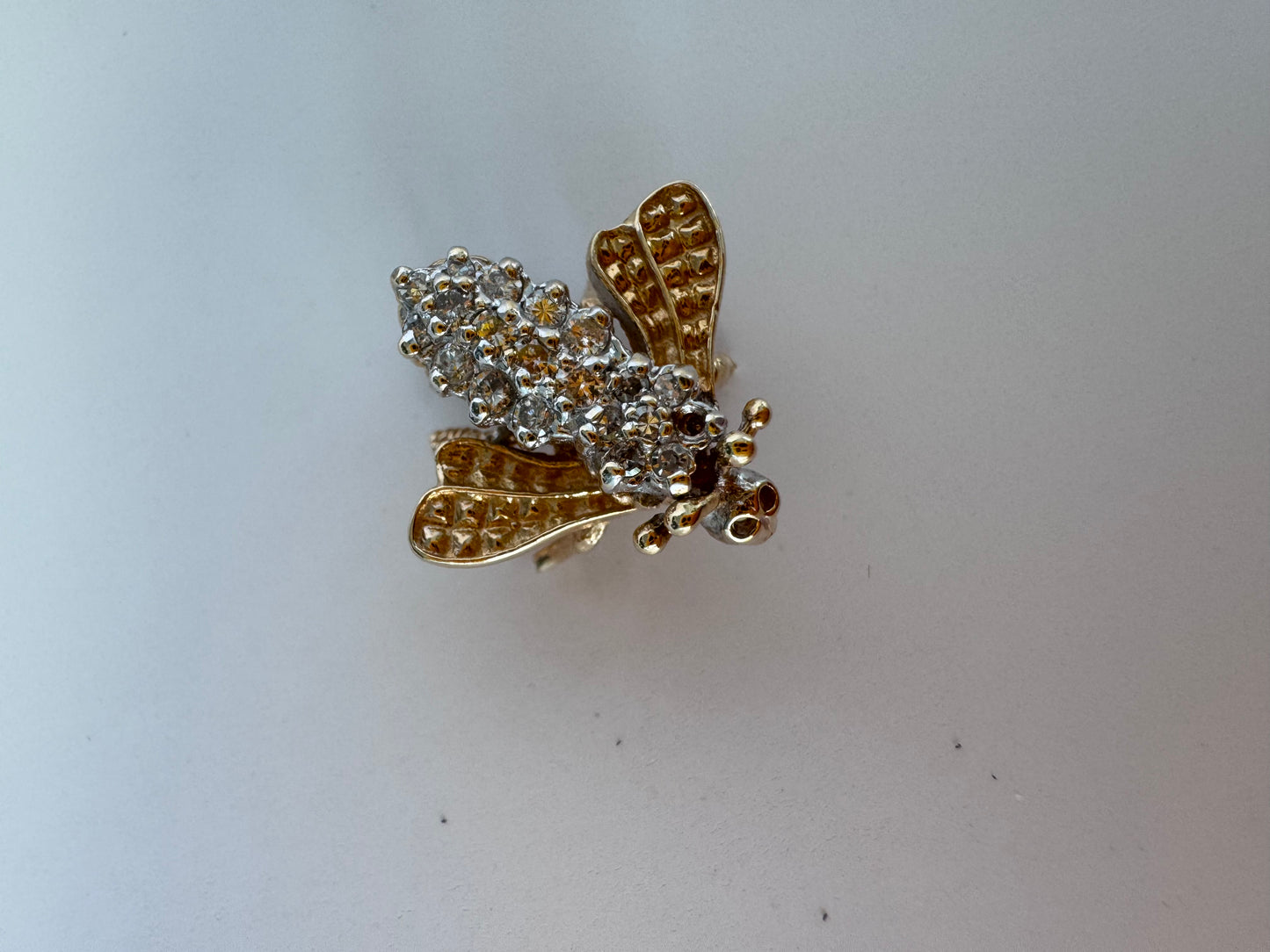 Estate 14K gold bee brooch with diamond-encrusted body and textured wings, vintage insect pin jewelry