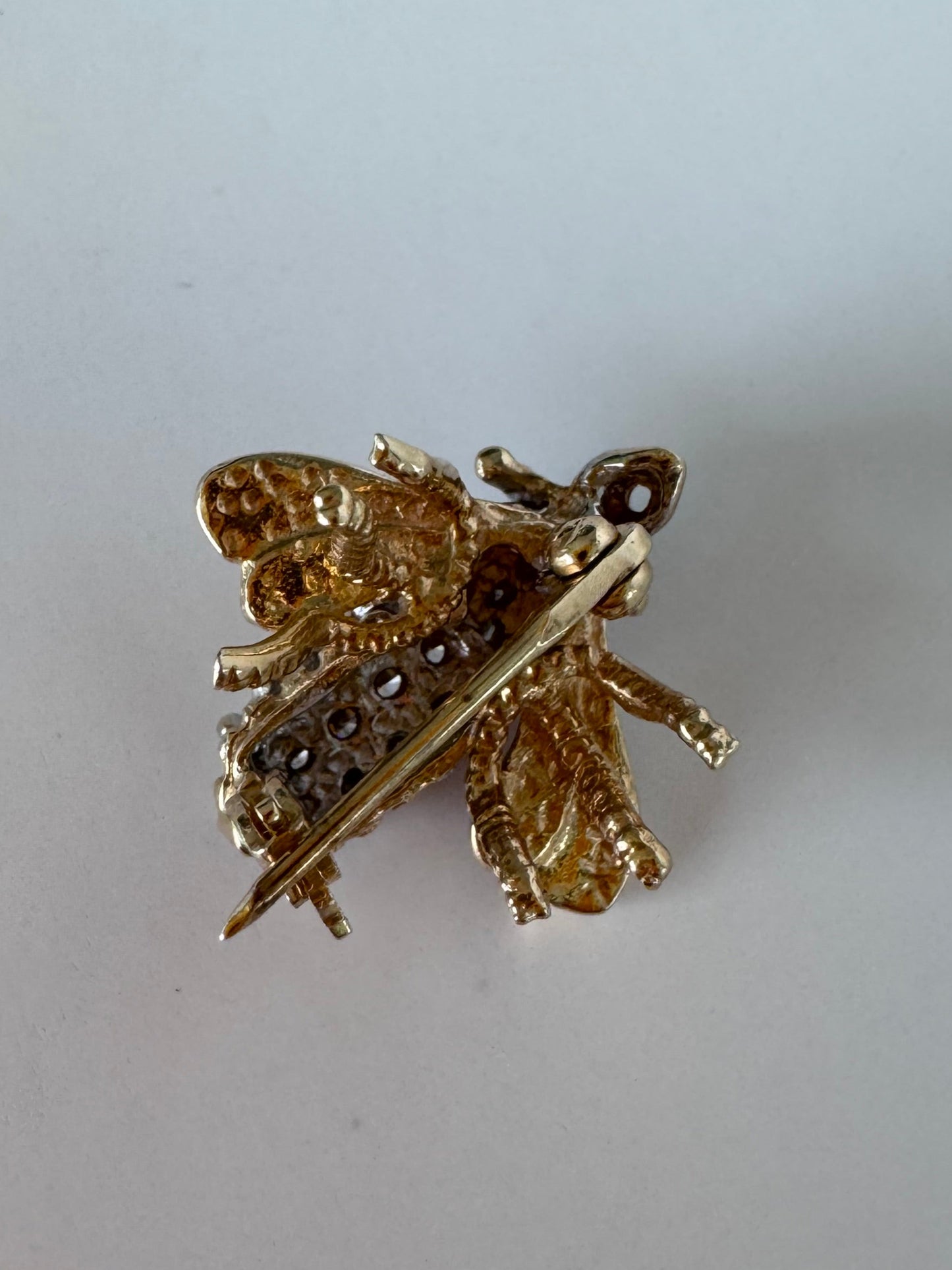Estate 14K gold bee brooch with diamond-encrusted body and textured wings, vintage insect pin jewelry