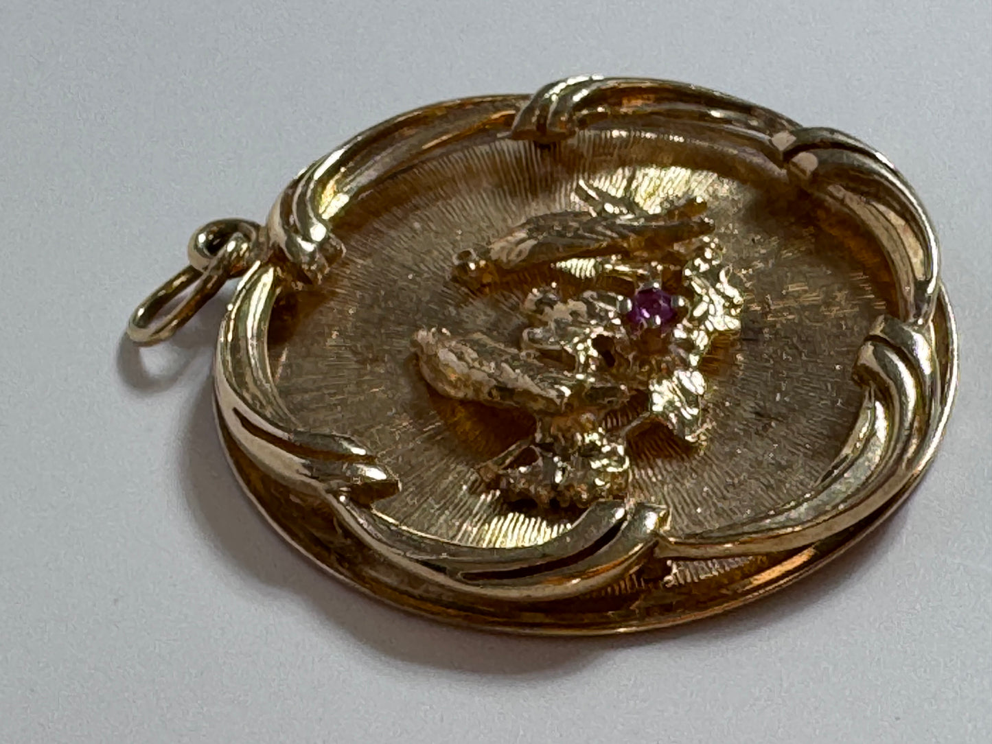 1950s 14K gold love birds medallion pendant with engine turned background and ruby accent, vintage romantic jewelry