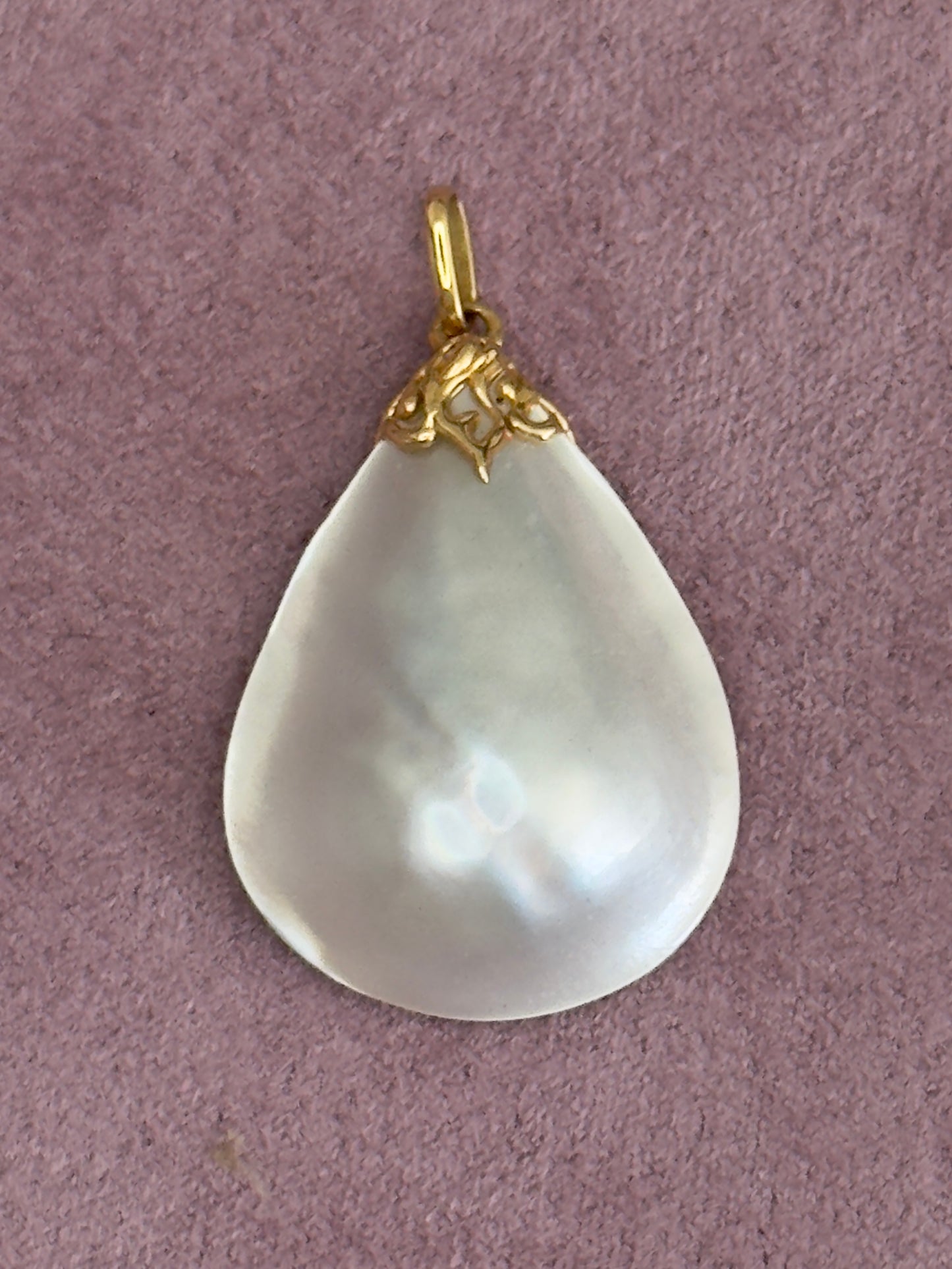 Vintage mother of pearl teardrop pendant with natural golden striping and 14k gold decorative bail, estate jewelry