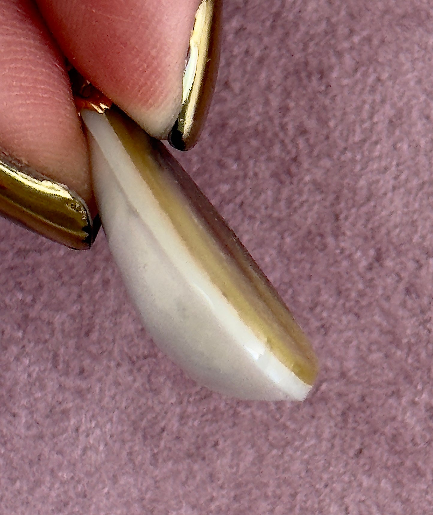 Vintage mother of pearl teardrop pendant with natural golden striping and 14k gold decorative bail, estate jewelry