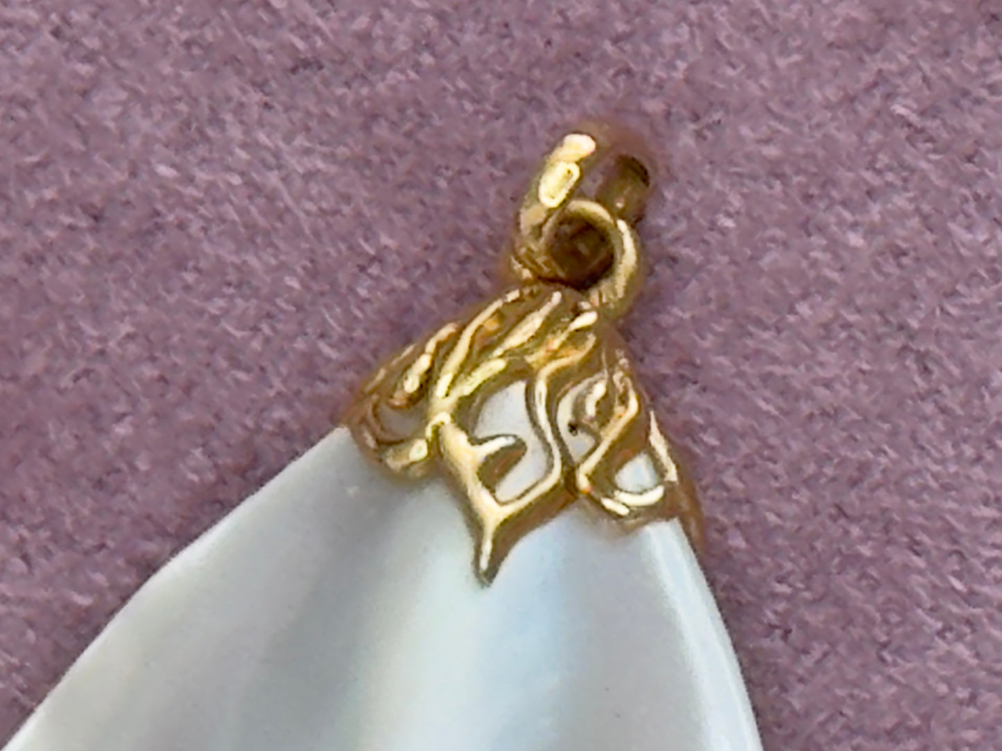 Vintage mother of pearl teardrop pendant with natural golden striping and 14k gold decorative bail, estate jewelry