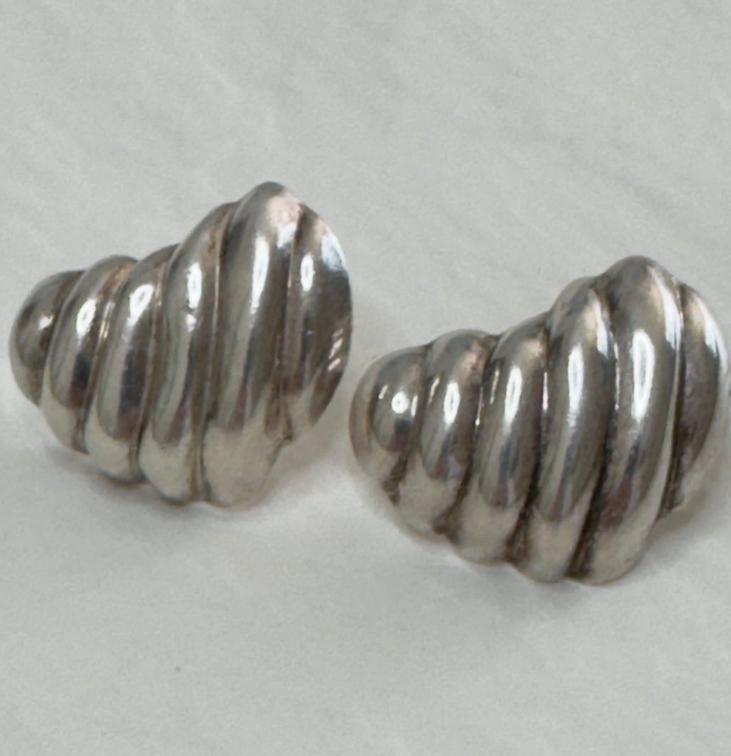 Vintage Mexican sterling silver ribbed puffy heart earrings with dimensional swirl pattern and high polish finish