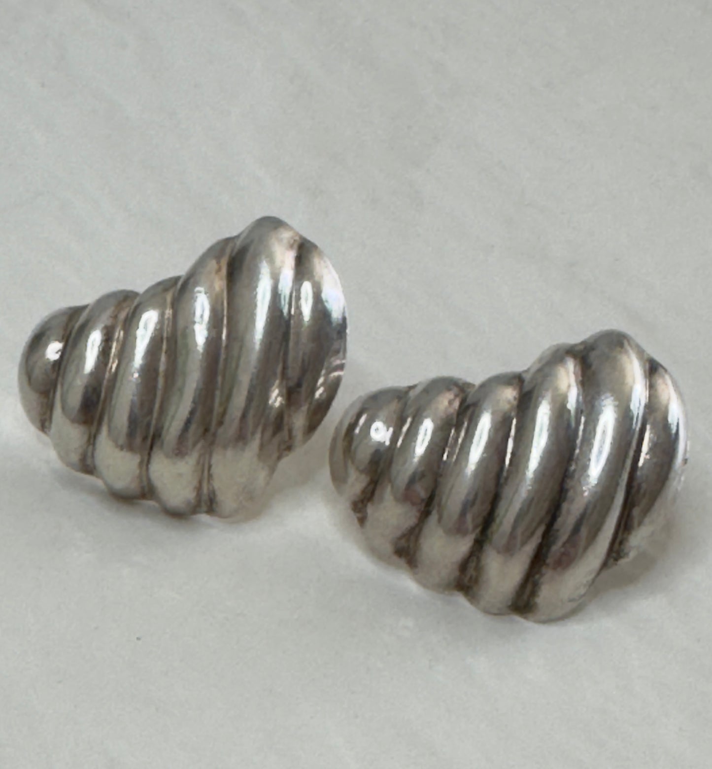 Vintage Mexican sterling silver ribbed puffy heart earrings with dimensional swirl pattern and high polish finish