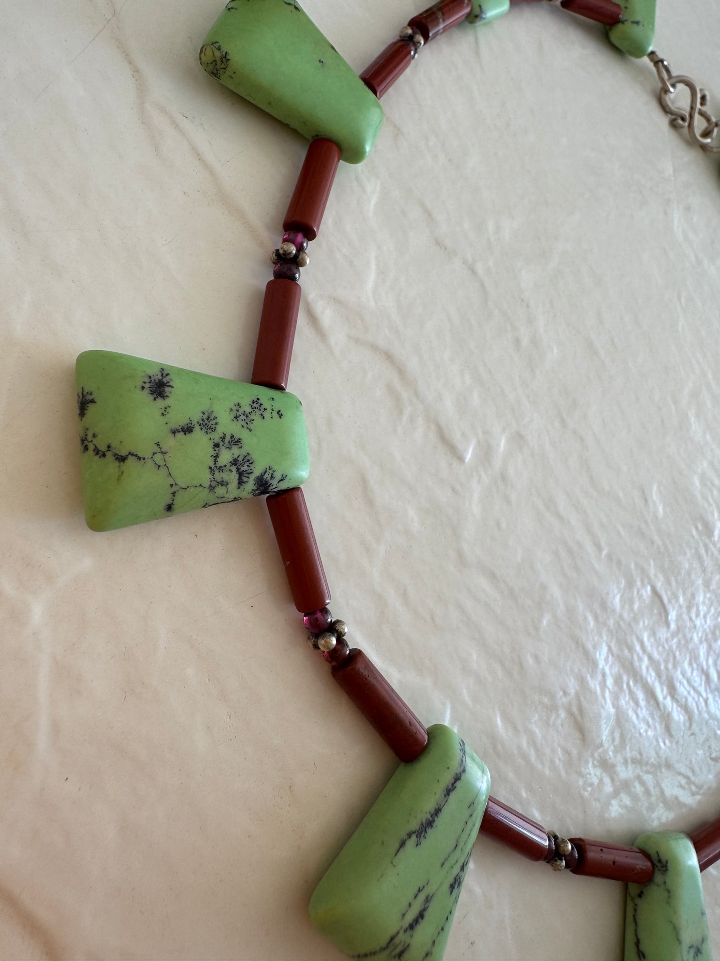 Vintage green aventurine garnet agate sterling silver beaded necklace with black matrix patterns and S-hook clasp from 1970s-80s
Shopify Tags:
vintage aventurine necklace, green aventurine jewelry, garnet necklace, vintage gemstone necklace, sterling silver necklace, 1970s jewelry, 1980s jewelry, bohemian necklace, New Age jewelry, metaphysical jewelry, crystal healing jewelry, vintage boho necklace, estate jewelry, vintage beaded necklace, aventurine garnet necklace, vintage stone necklace, hippie jewelry,