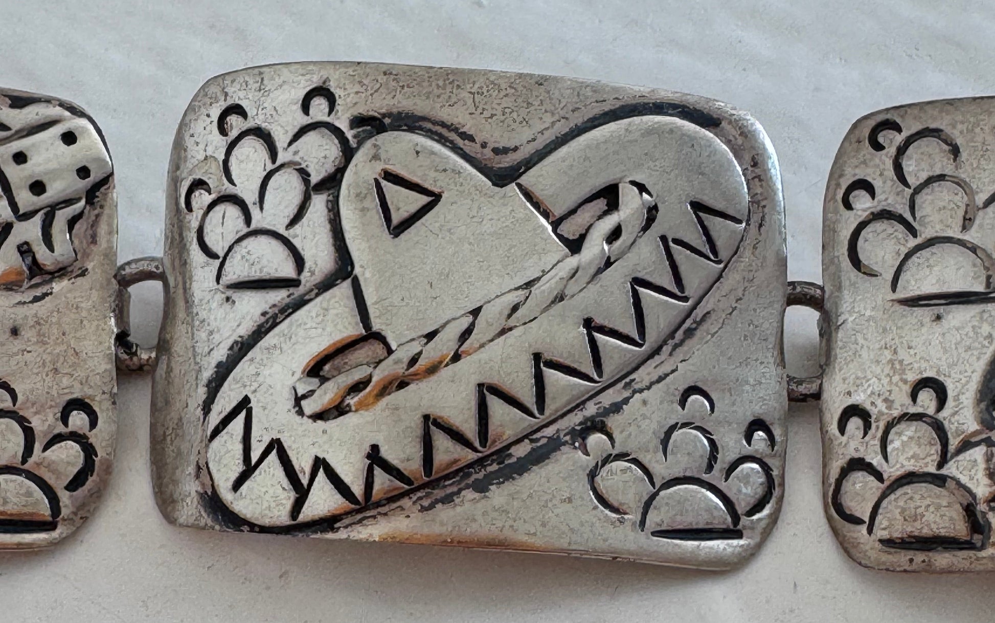 Estate J. Alvarez Taxco Mexican sterling silver storyteller panel bracelet showing detailed cultural scenes with guitar player, pottery, and folk motifs