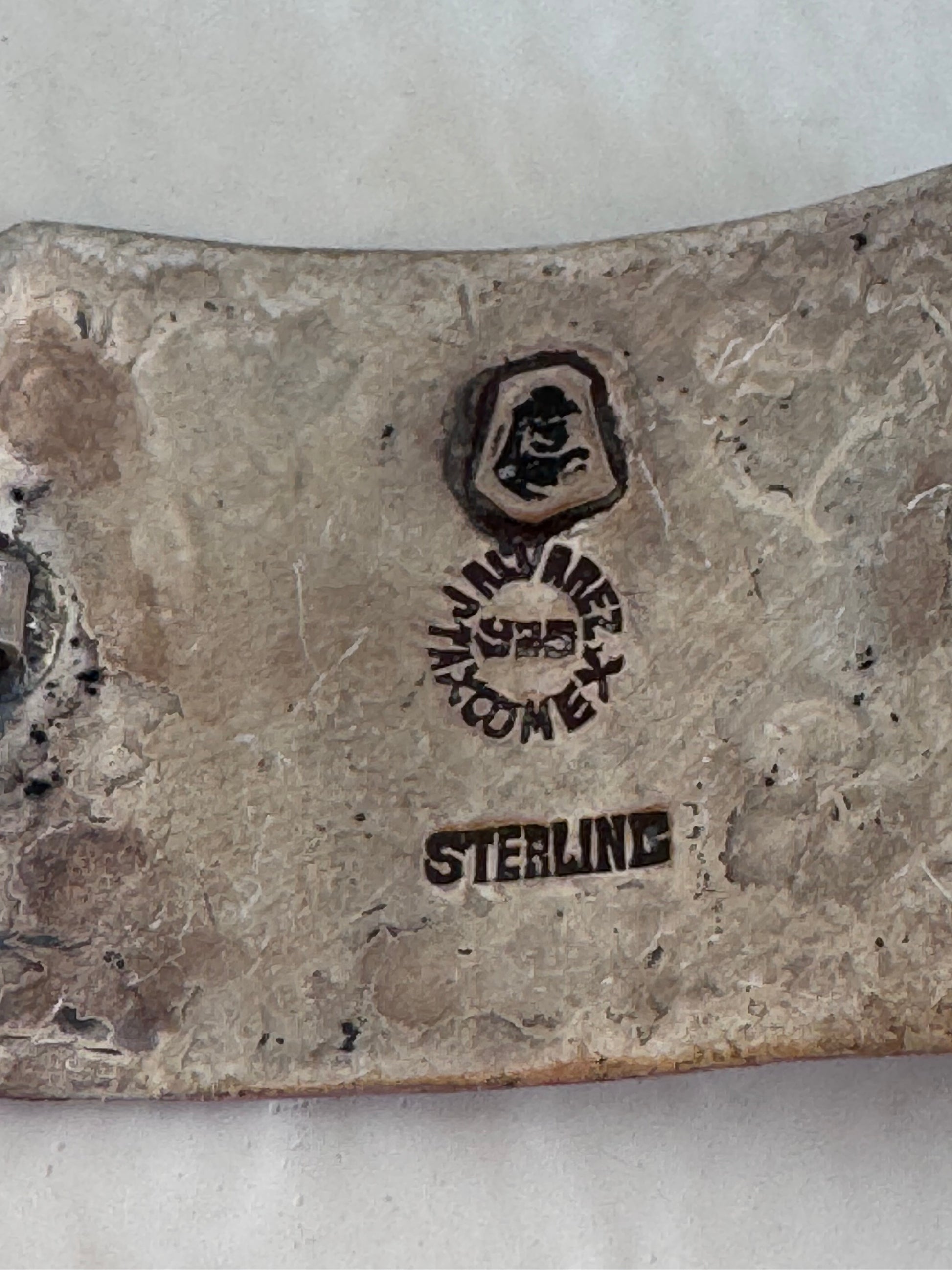 Estate J. Alvarez Taxco Mexican sterling silver storyteller panel bracelet showing detailed cultural scenes with guitar player, pottery, and folk motifs