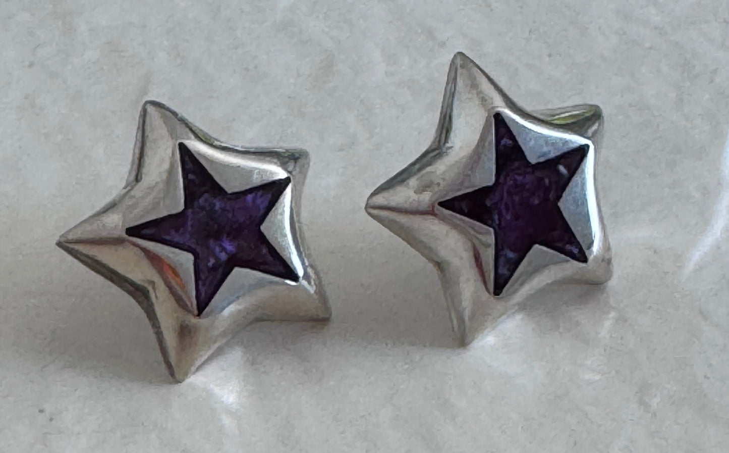 Estate Taxco Mexican sterling silver star earrings with deep purple enamel inlay, showing TD-89 workshop marking and dimensional construction