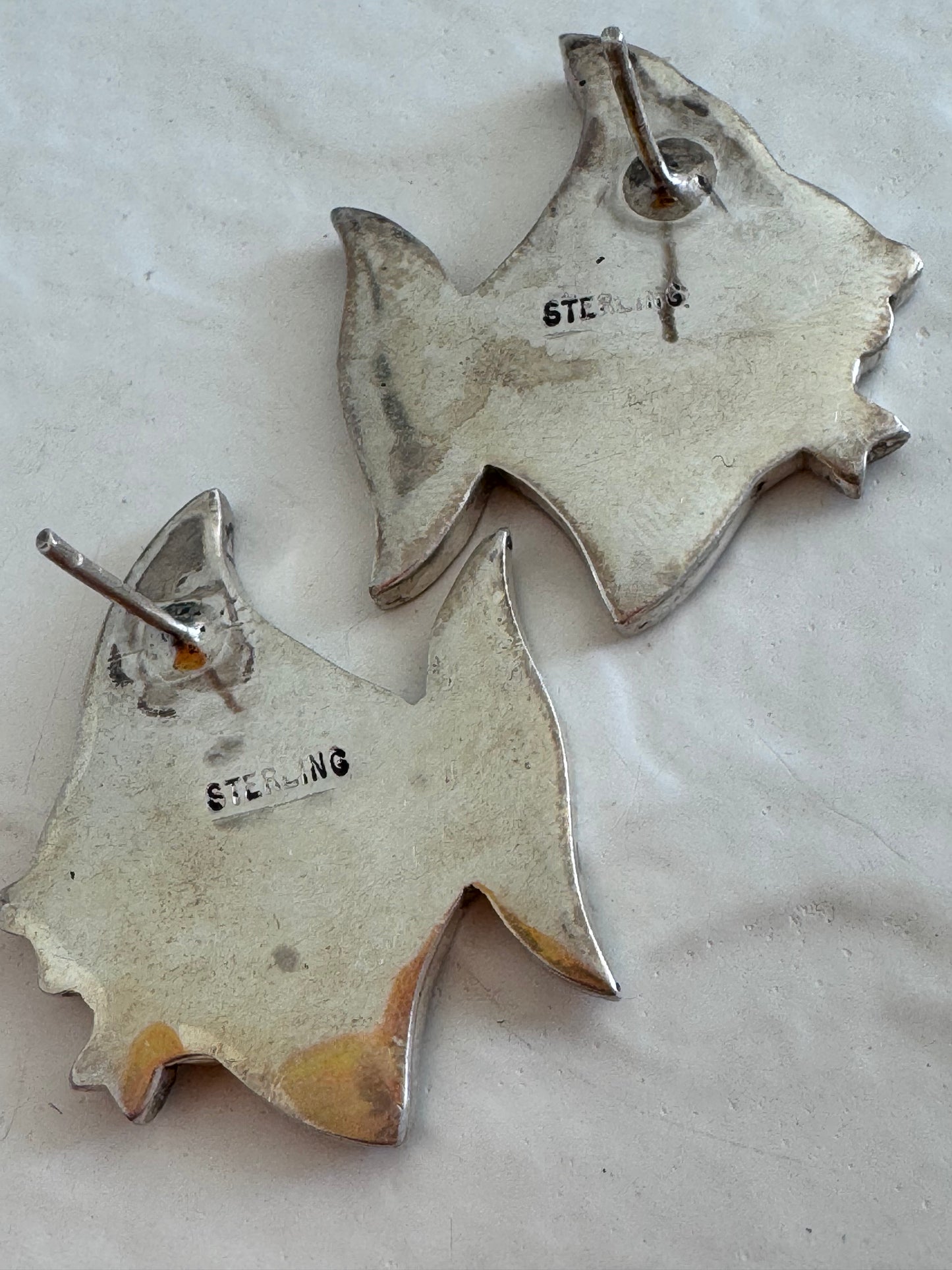 Vintage sterling silver angelfish brooches with mother of pearl mosaic inlay and red accent eyes
