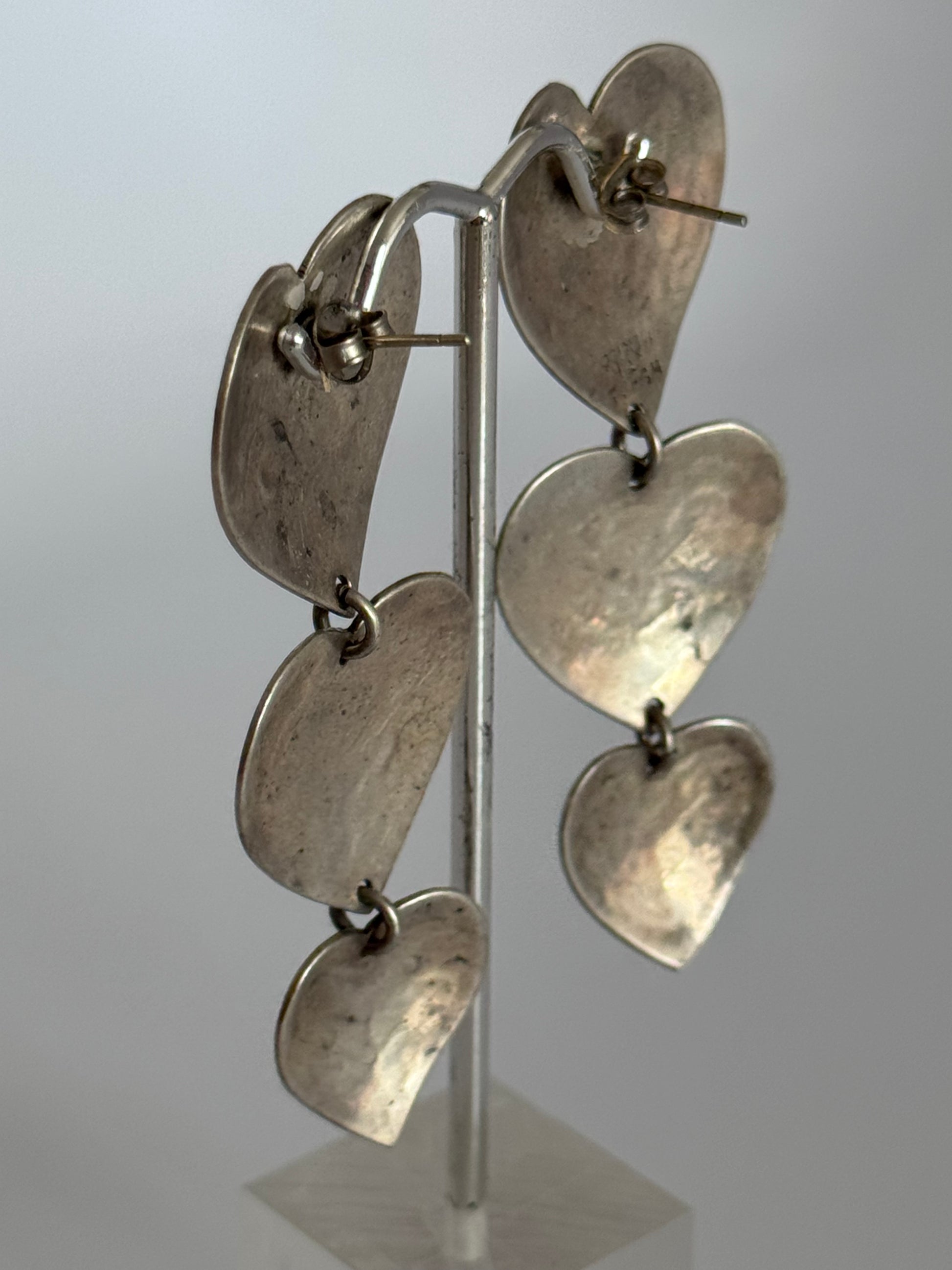 Estate Mexican sterling silver heart jewelry set with triple dangle earrings and matching pendant, hand-stamped folk designs, 925 hallmarks