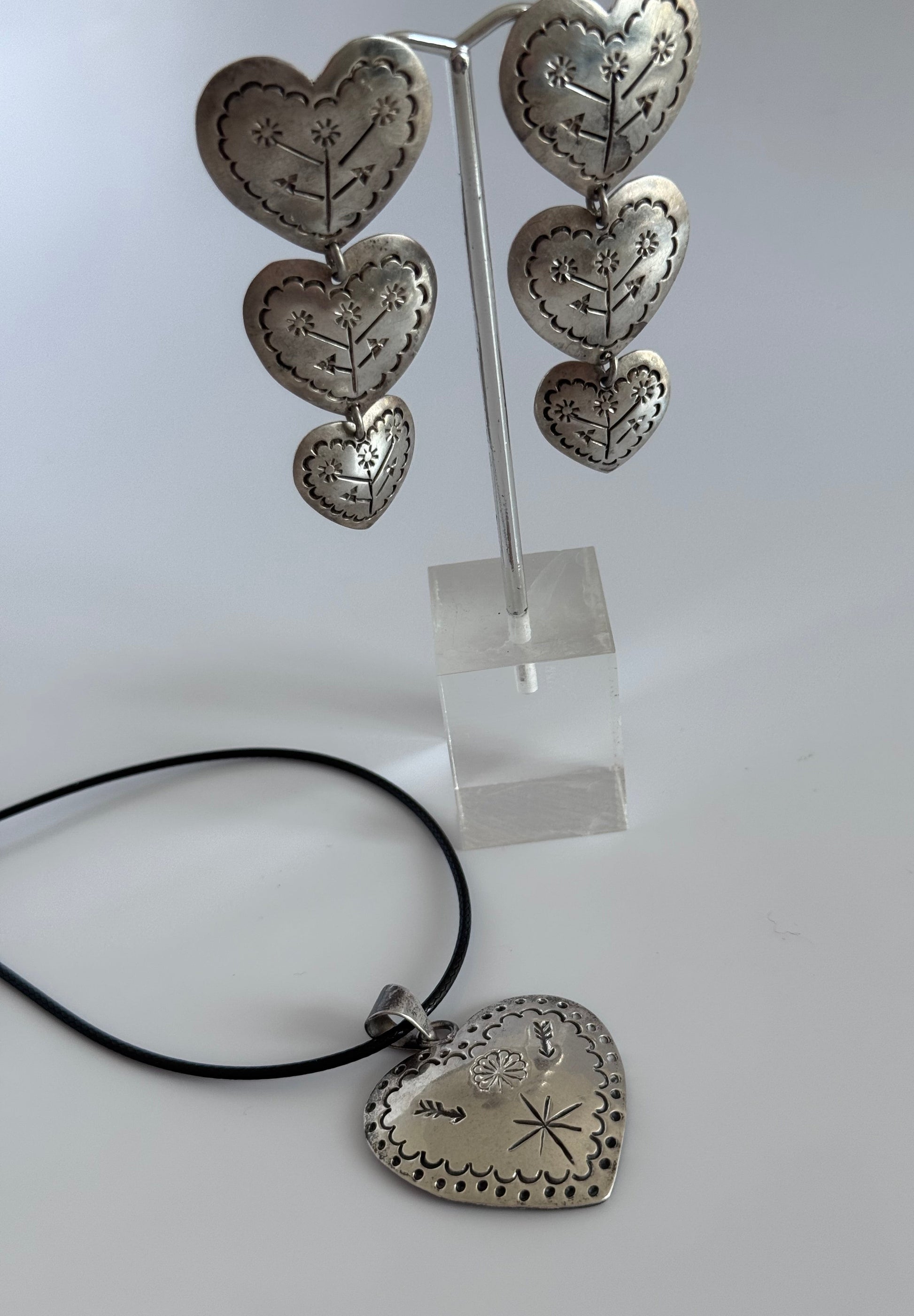 Estate Mexican sterling silver heart jewelry set with triple dangle earrings and matching pendant, hand-stamped folk designs, 925 hallmarks