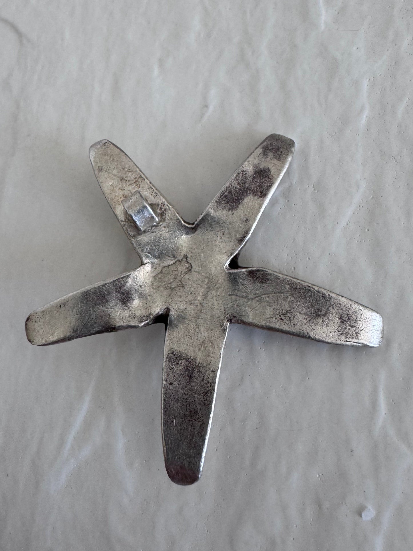 Large Karen Hill Tribe silver starfish pendants with textured surface showing authentic handcrafted details and hidden bail construction