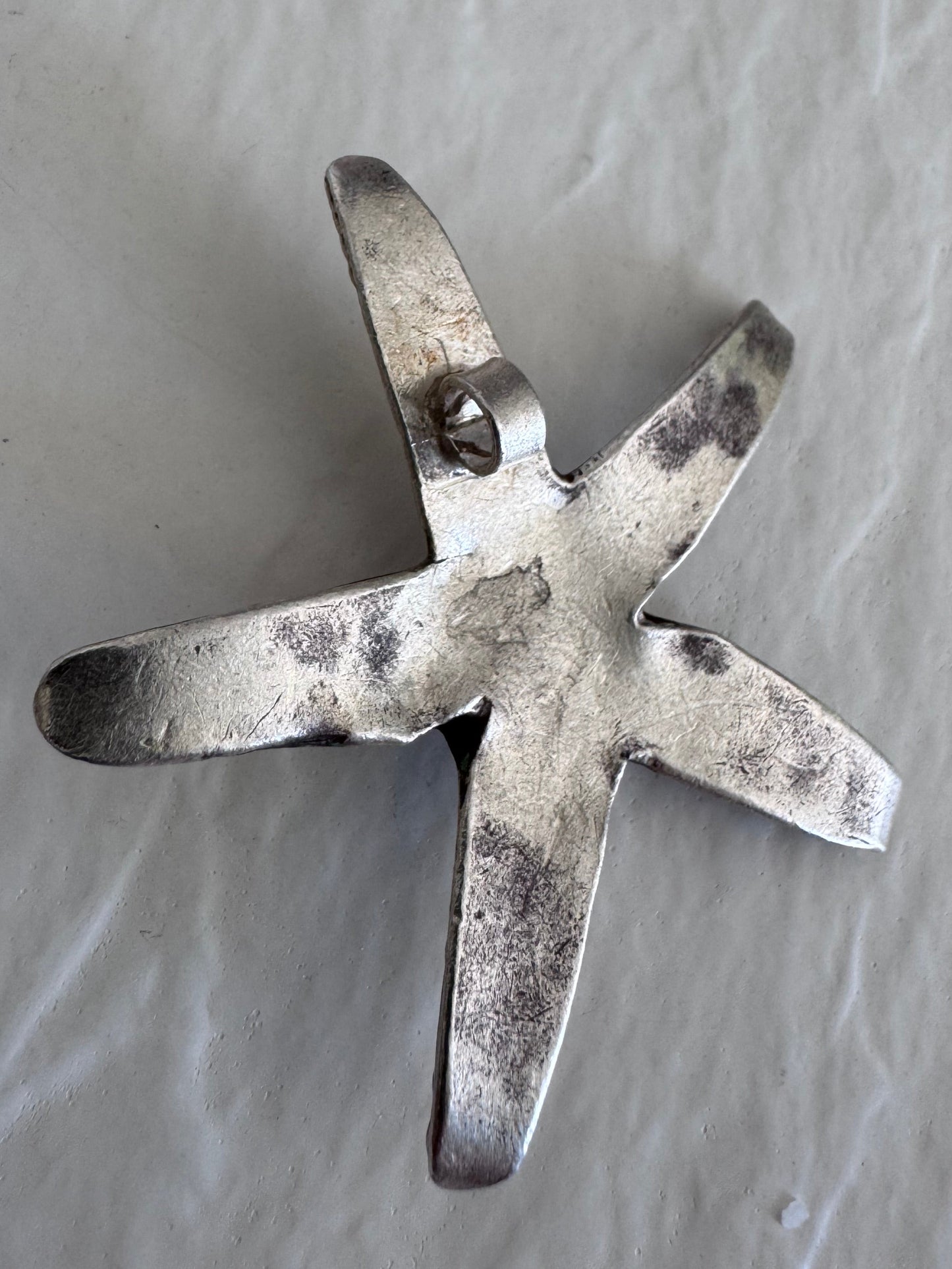 Large Karen Hill Tribe silver starfish pendants with textured surface showing authentic handcrafted details and hidden bail construction