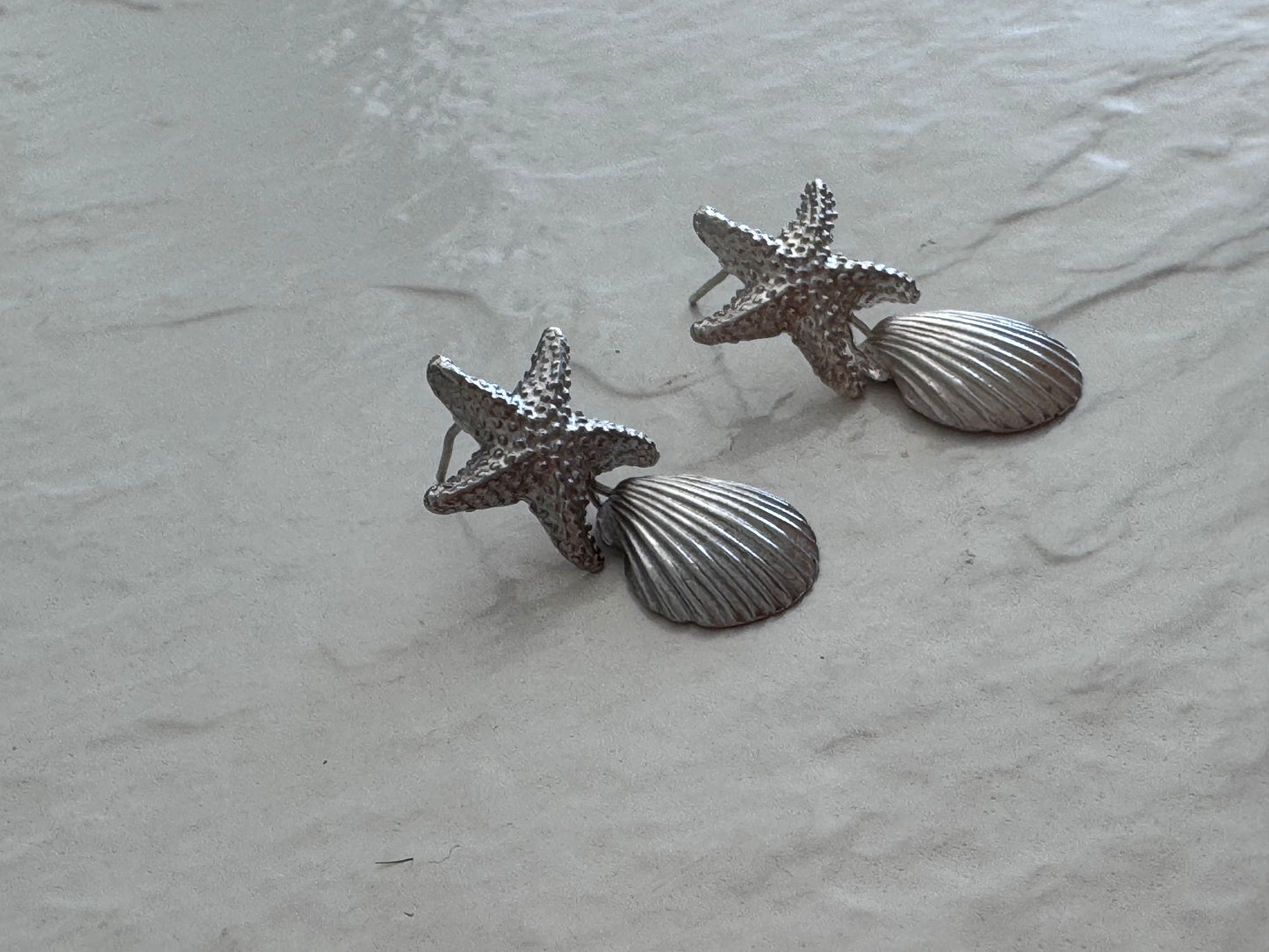 Vintage sterling silver starfish and shell drop earrings with textured detailing and wire connections