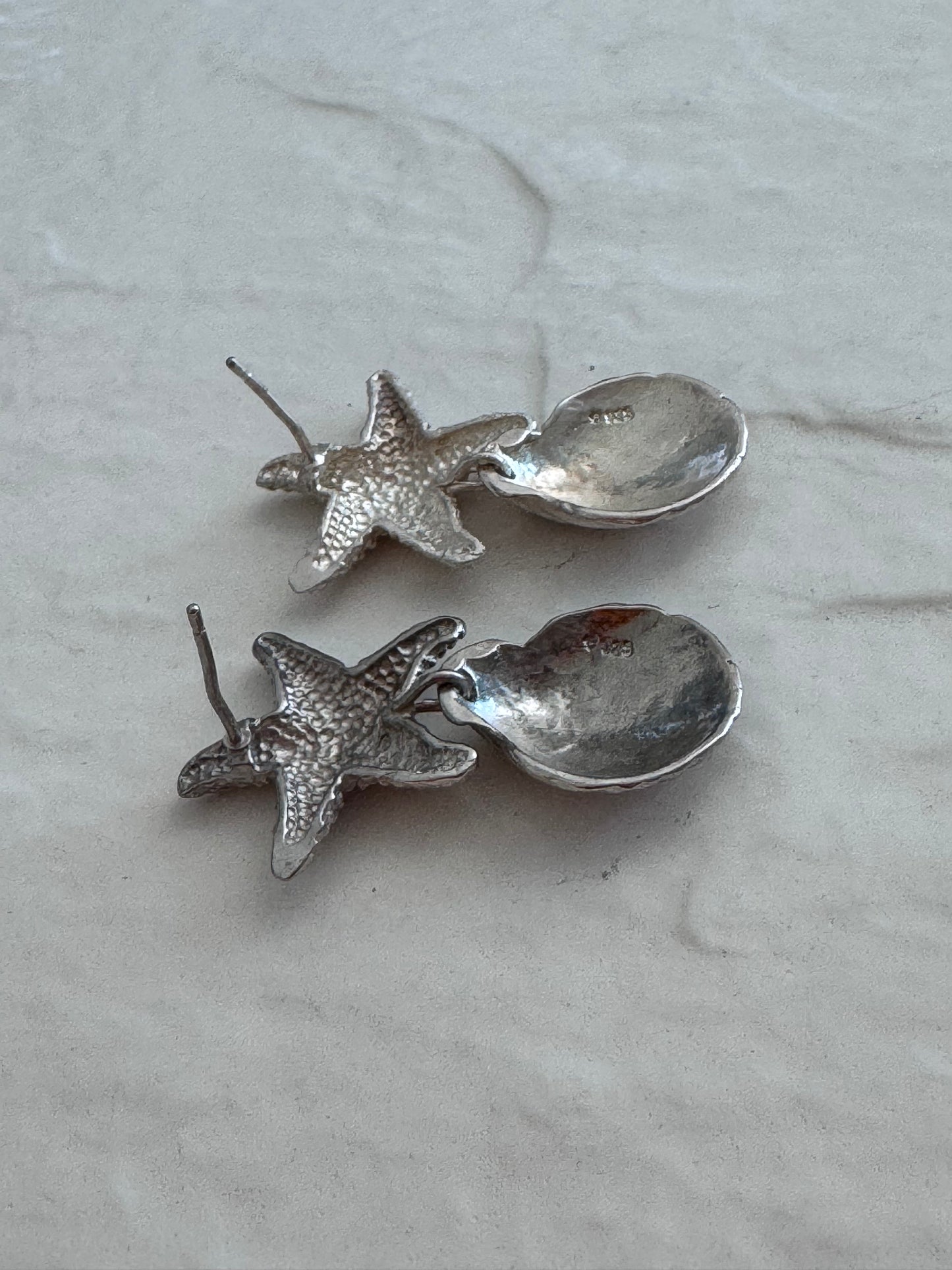 Vintage sterling silver starfish and shell drop earrings with textured detailing and wire connections