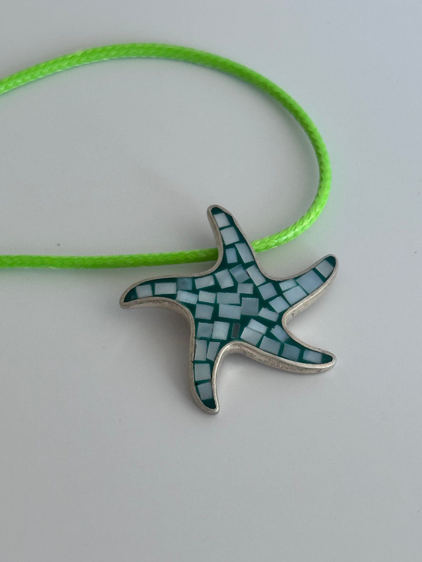 Vintage sterling silver starfish pendant with mother of pearl and green resin mosaic inlay, showing detailed craftsmanship and 925 hallmark