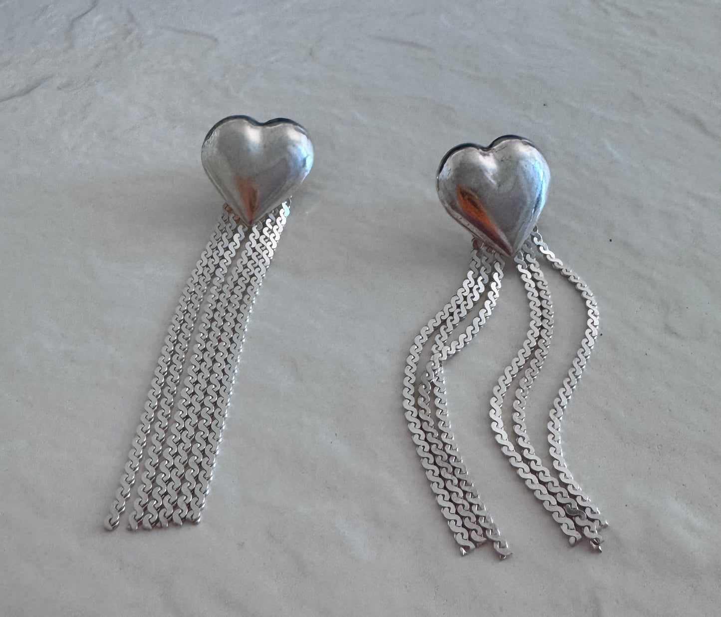 Vintage sterling silver puffy heart earrings with chain tassel fringe, showing 925 hallmarks and never-worn condition