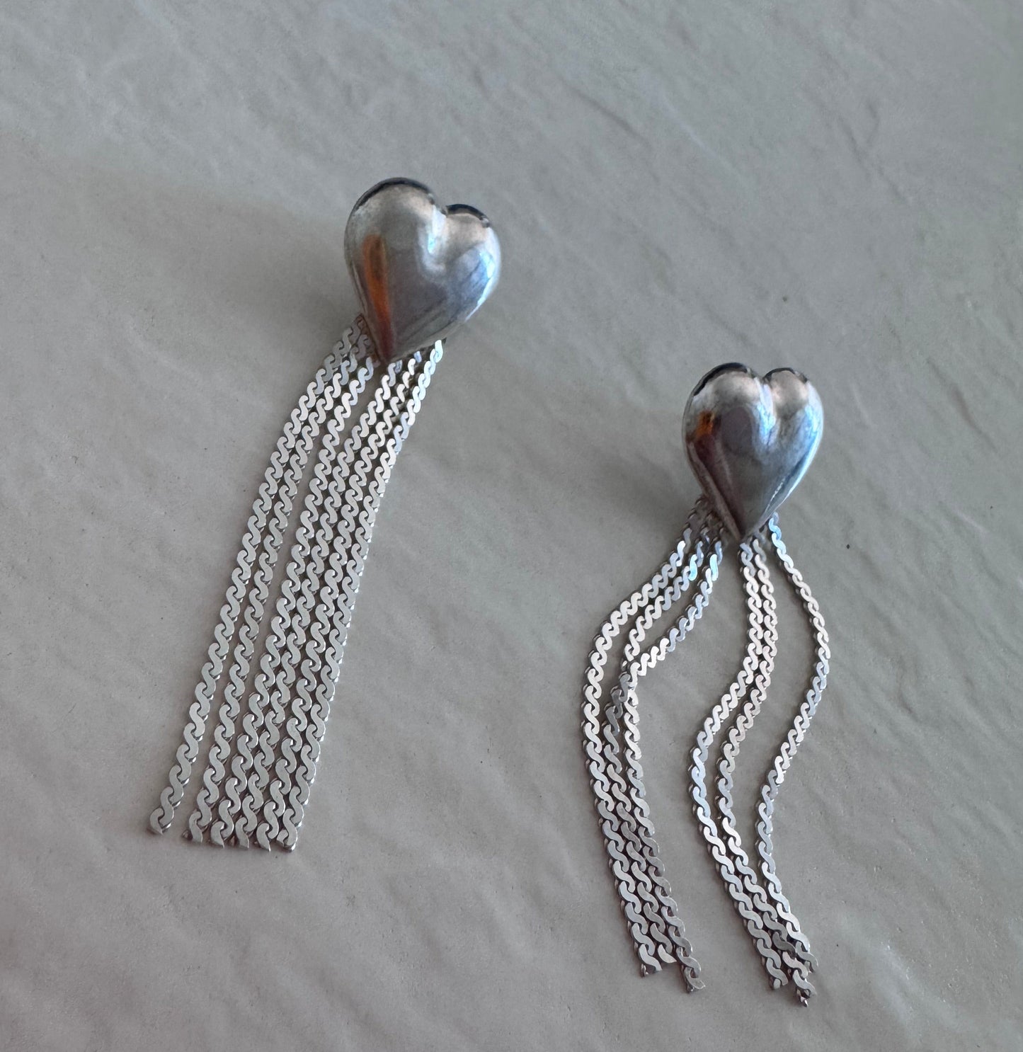 Vintage sterling silver puffy heart earrings with chain tassel fringe, showing 925 hallmarks and never-worn condition