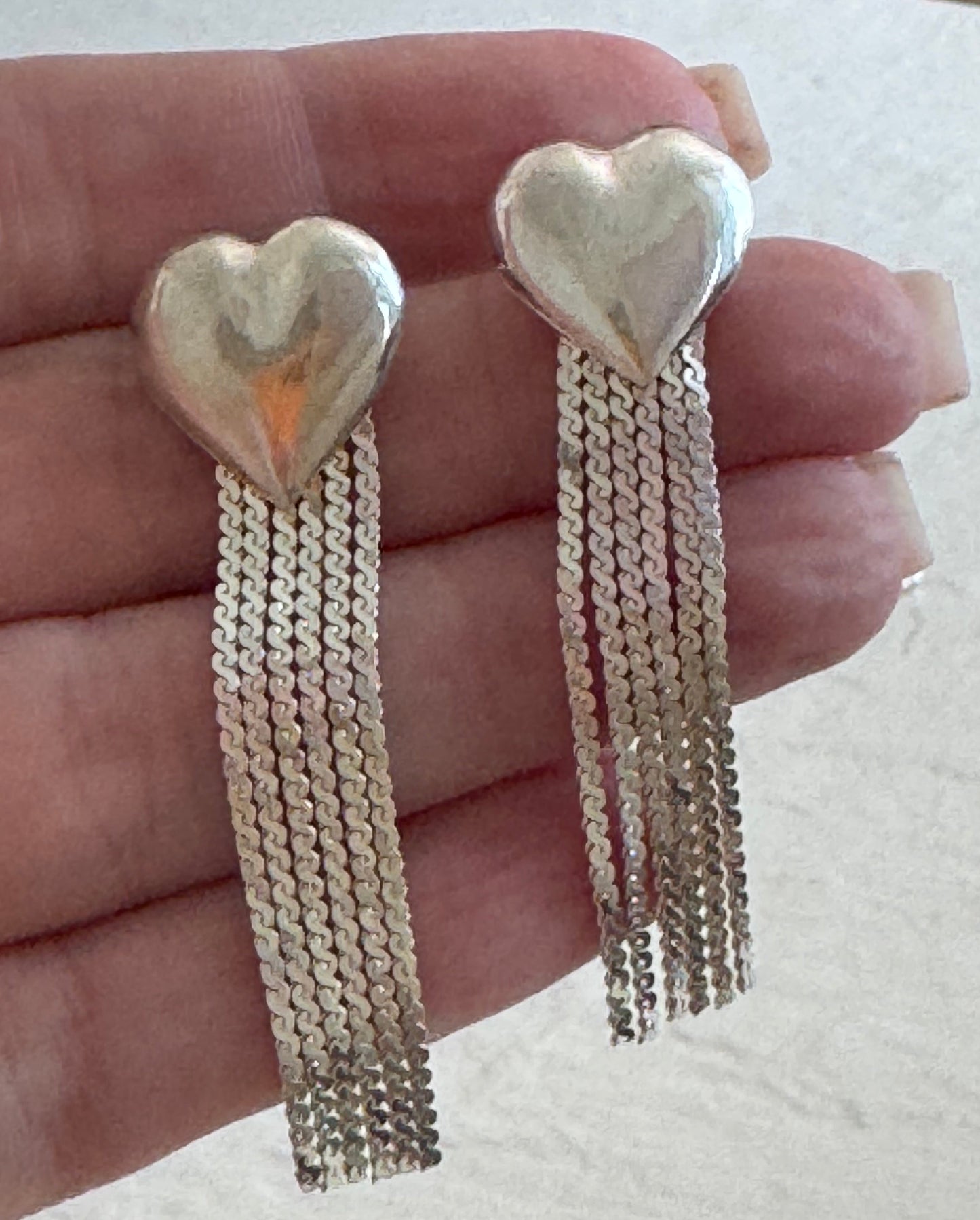 Vintage sterling silver puffy heart earrings with chain tassel fringe, showing 925 hallmarks and never-worn condition
