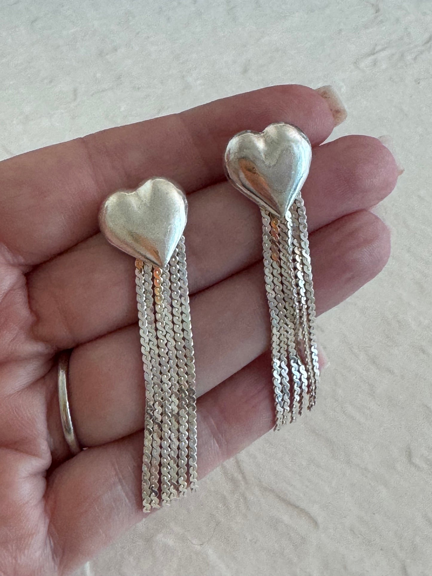 Vintage sterling silver puffy heart earrings with chain tassel fringe, showing 925 hallmarks and never-worn condition