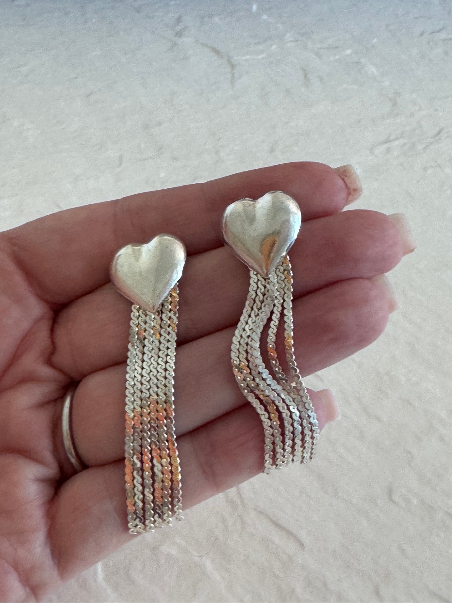 Vintage sterling silver puffy heart earrings with chain tassel fringe, showing 925 hallmarks and never-worn condition