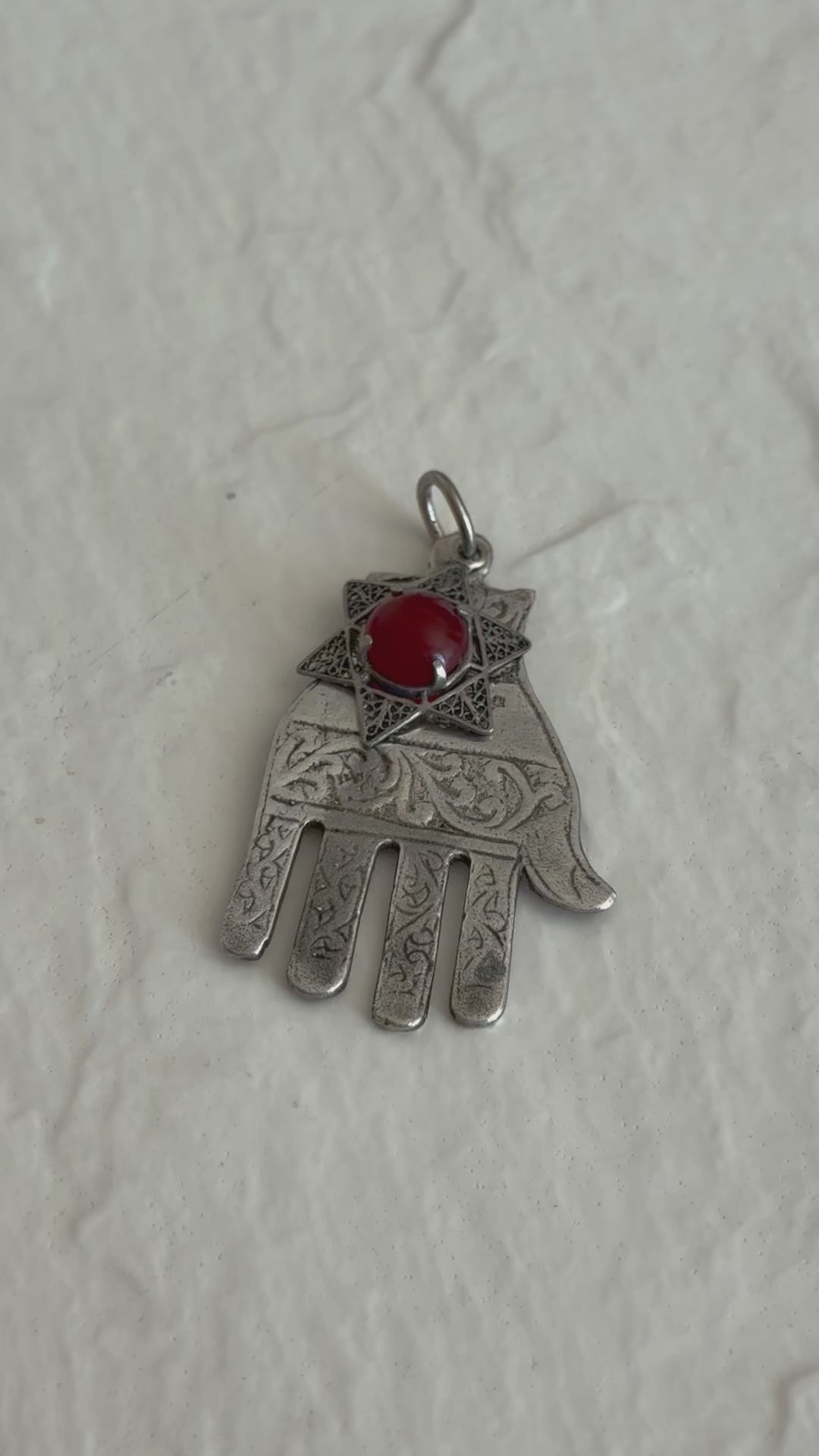 Sterling silver Hamsa hand pendant with Star of David and carnelian stone featuring detailed filigree work and Hebrew text