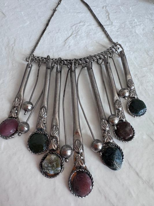 Estate vintage silver fringe necklace with multiple natural stones in purple green and brown tones showing bohemian statement jewelry design