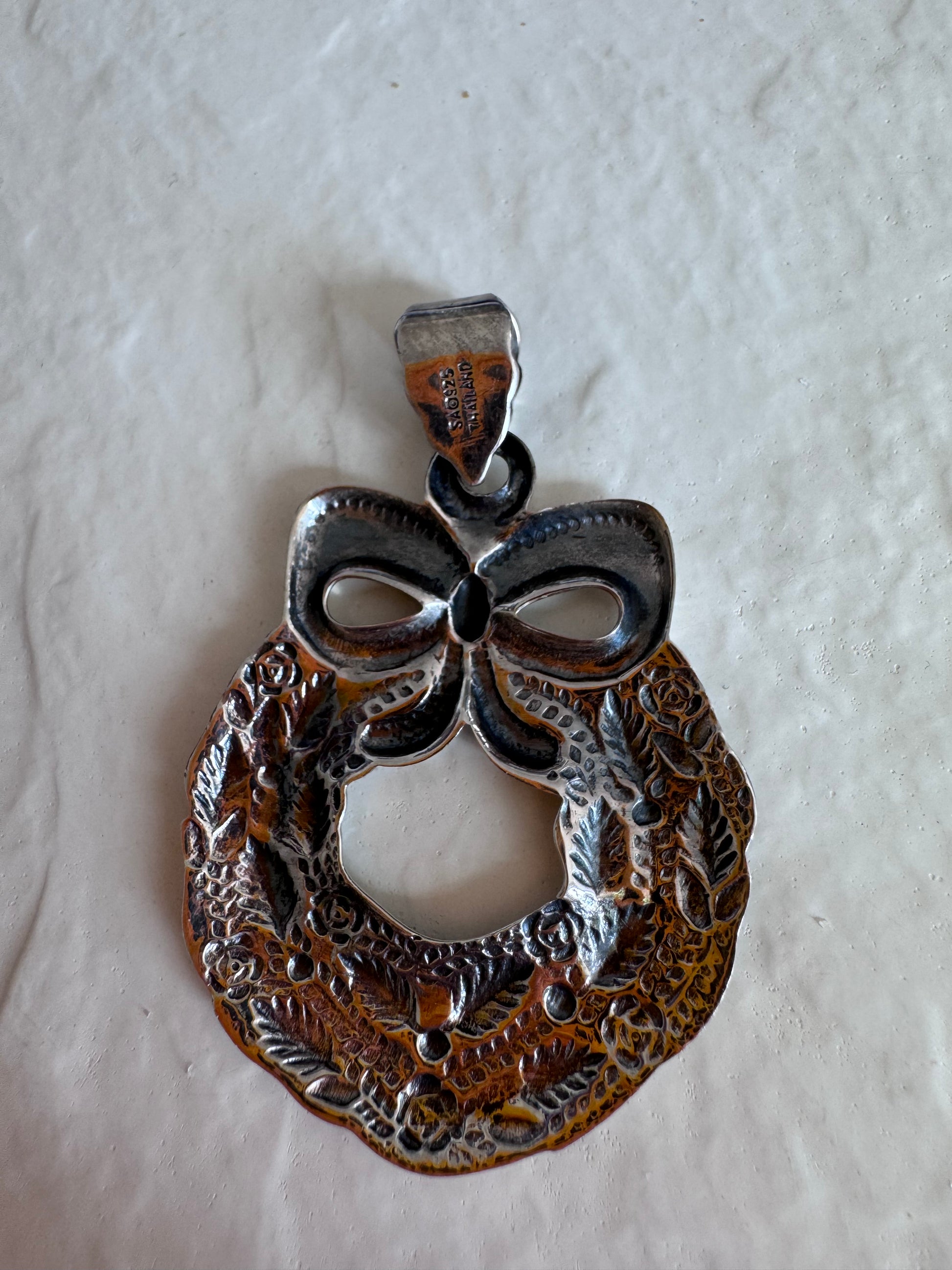 Estate 925 sterling silver Christmas wreath pendant from Thailand with detailed roses leaves and bow showing intricate Thai craftsmanship