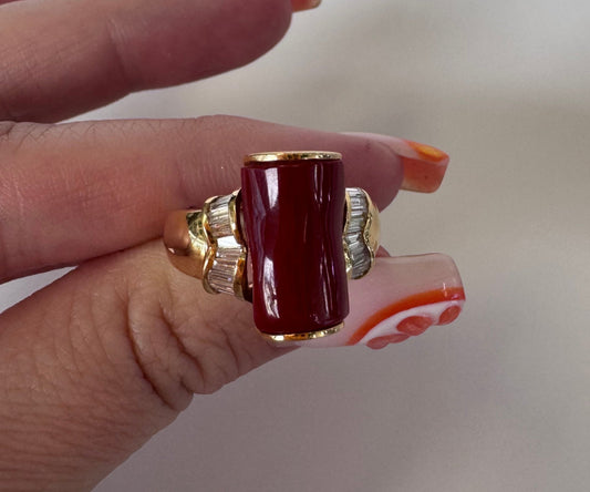 Estate 18K gold ring featuring natural deep red coral centerpiece with diamond baguettes, cocktail ring size 8