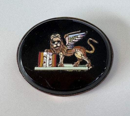 Antique sterling silver micro mosaic brooch featuring winged Lion of St. Mark in colorful glass tesserae on black background, Venetian Grand Tour souvenir jewelry