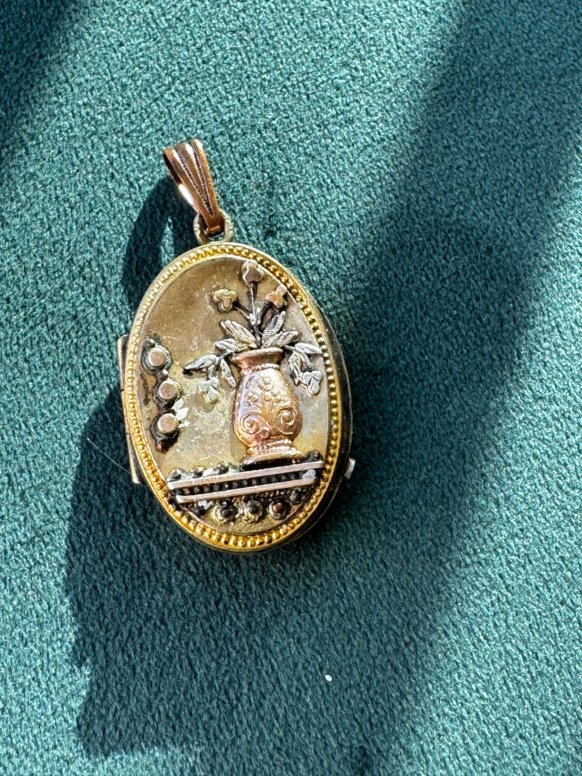 Antique Victorian rolled gold locket with engraved flower vase, multicolored gold, oval shape