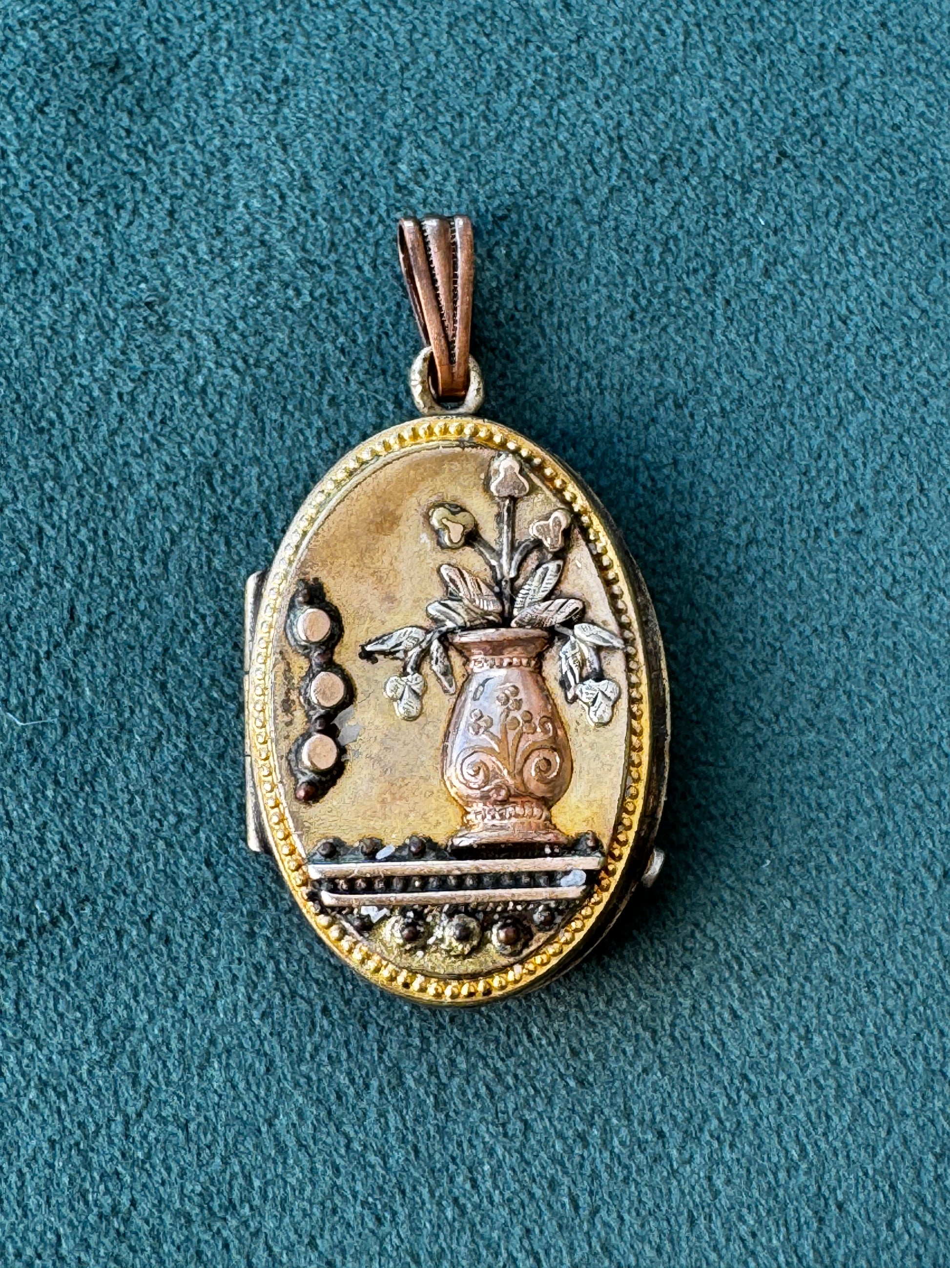 Antique Victorian rolled gold locket with engraved flower vase, multicolored gold, oval shape