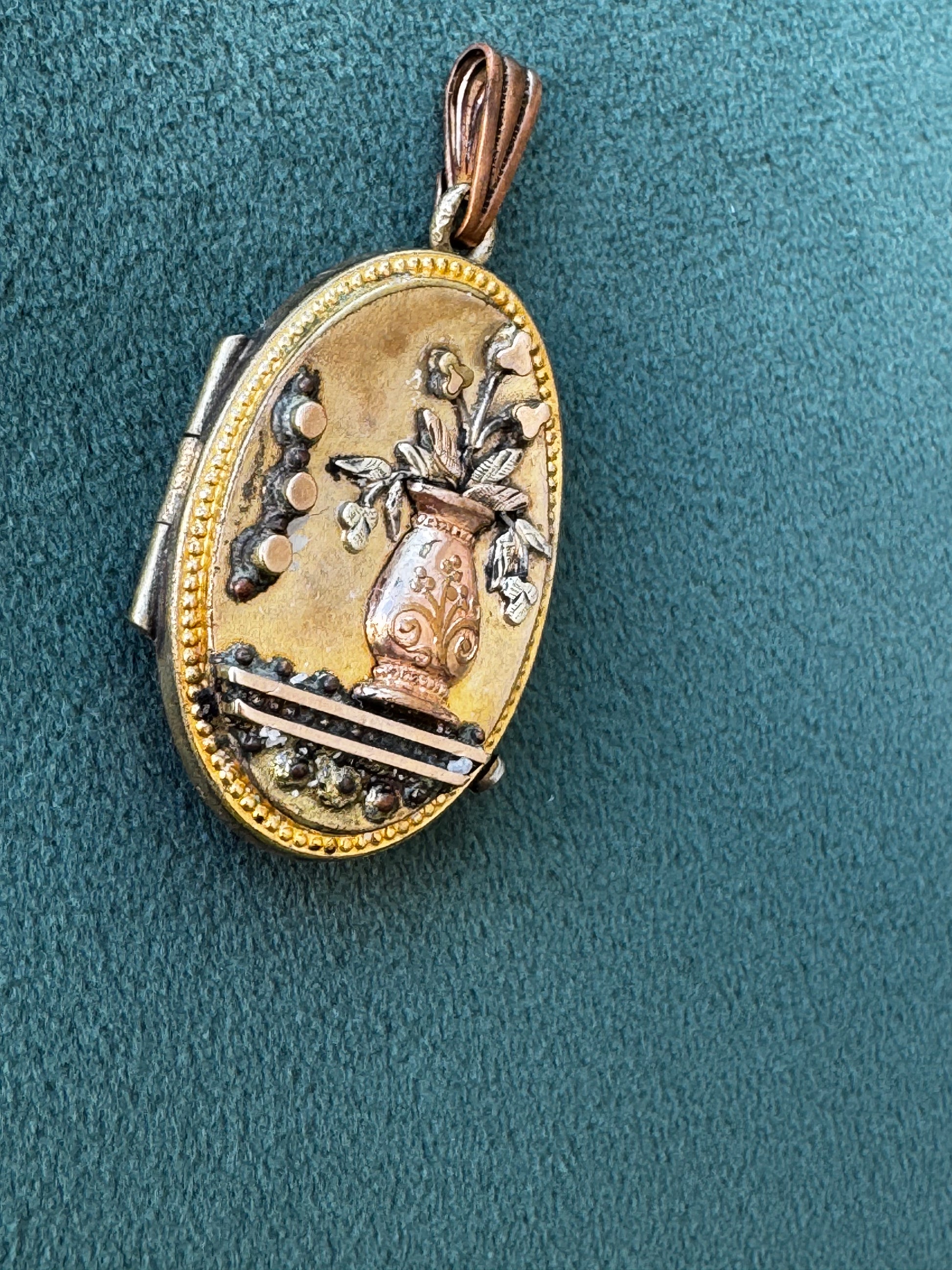 Antique Victorian rolled gold locket with engraved flower vase, multicolored gold, oval shape