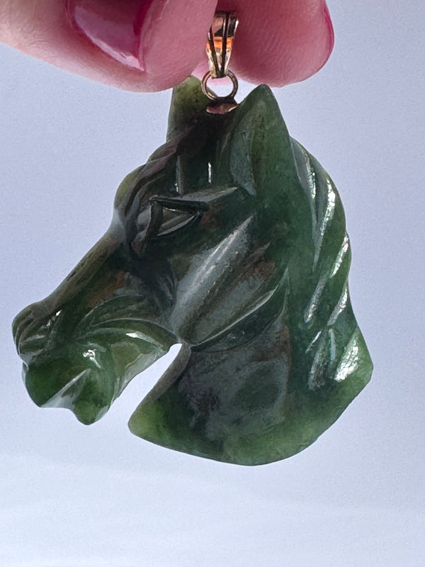 Estate vintage 14K gold pendant featuring hand-carved natural imperial green jadeite horse head with olive undertones, Chinese zodiac equestrian jewelry