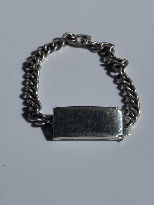 Vintage WWII sterling silver ID bracelet with curb chain and secret locket compartment, estate condition with engravable surface