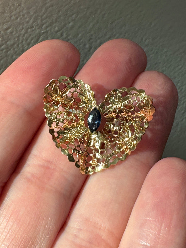 Estate 1980s 14K yellow gold heart slide pendant with blue sapphire centerstone and intricate pierced filigree openwork design