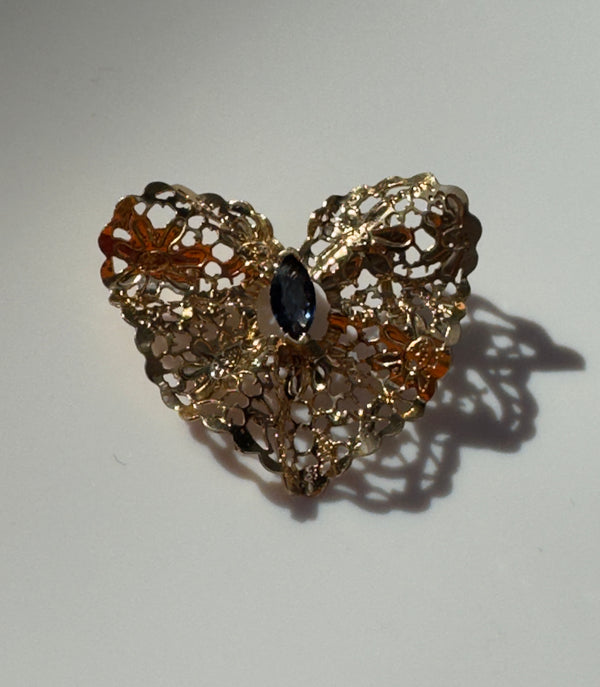 Estate 1980s 14K yellow gold heart slide pendant with blue sapphire centerstone and intricate pierced filigree openwork design