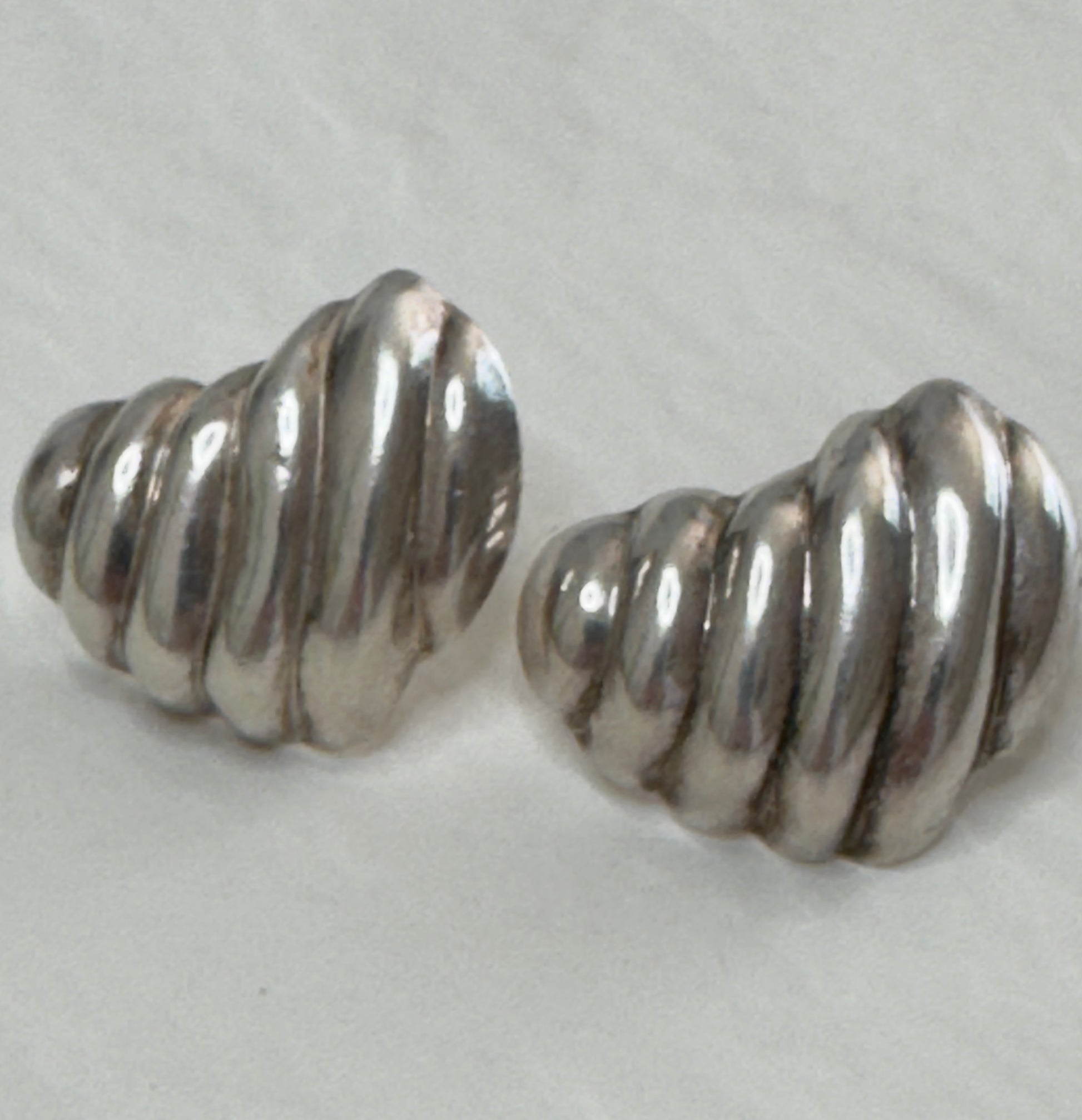 Vintage Mexican sterling silver ribbed puffy heart earrings with dimensional swirl pattern and high polish finish