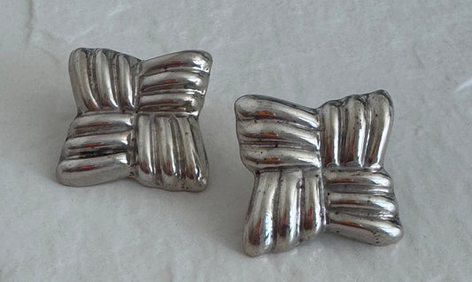Estate Taxco Mexican sterling silver large puffy ribbon bow earrings with T925 Mexico hallmarks, showing dimensional ridged design