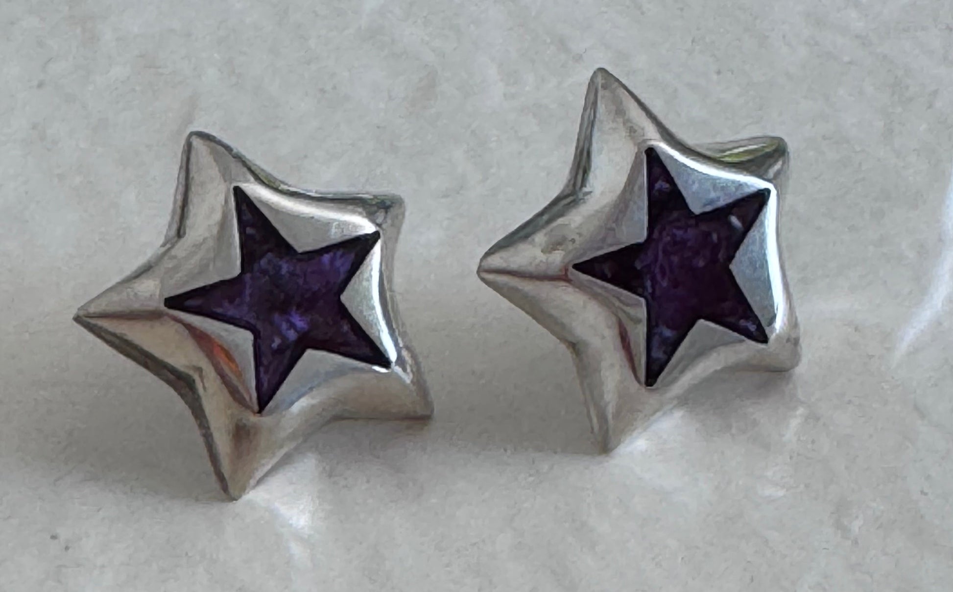 Estate Taxco Mexican sterling silver star earrings with deep purple enamel inlay, showing TD-89 workshop marking and dimensional construction