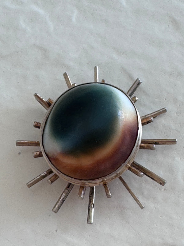 1940s sterling silver sunburst pendant with natural operculum center, WWII era modernist design with gold wash