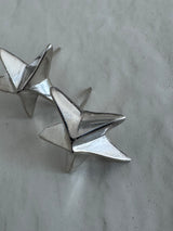 Estate sterling silver dimensional puffy star stud earrings with mirror finish, approximately half inch, showing quality construction